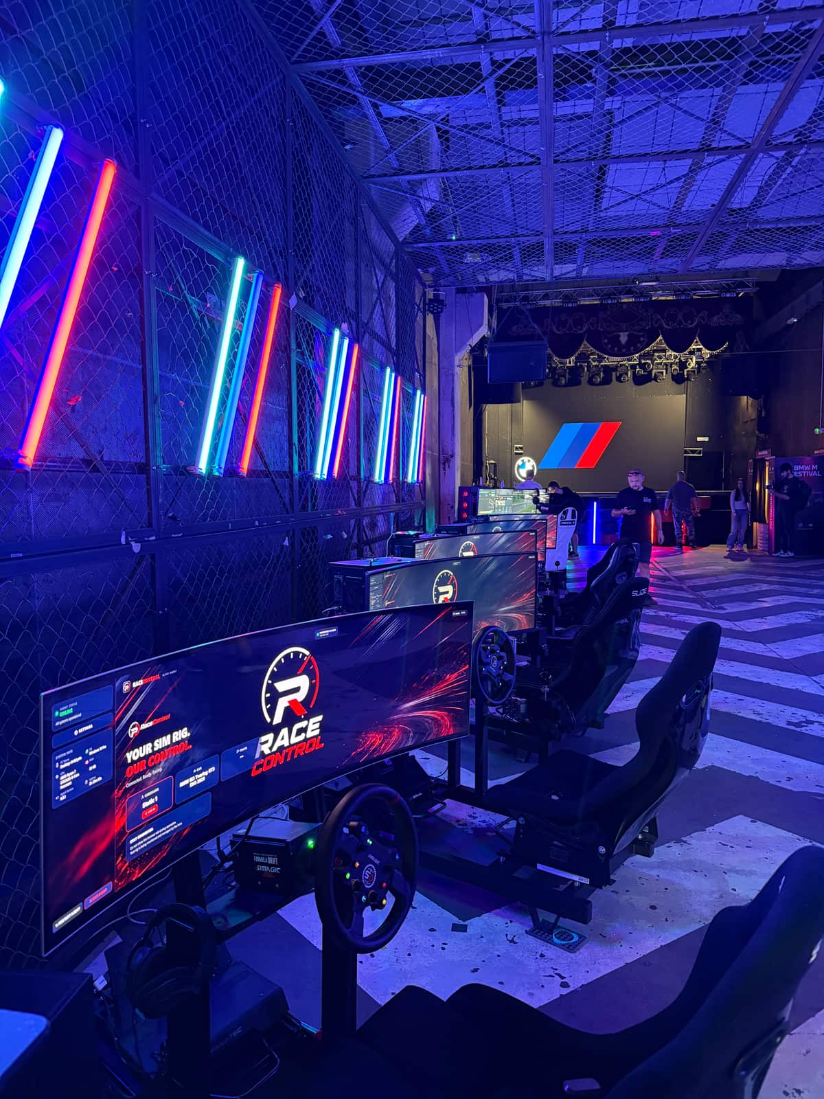 The row of simulators from the far end of the hall